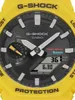 A close-up view of a yellow Casio G-Shock watch face. Náhled obrázku produktu