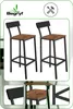 Two bar stools with wooden seats and black metal frames are shown against a white background. Smaller inset images show details of the stools. Podgląd zdjęcia produktu