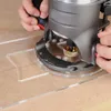 A close-up shot of a router being used with a template guide on a wooden surface. Produktbild-Vorschau