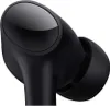 A close-up view of a black wireless earbud. Podgląd zdjęcia produktu