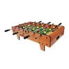 A tabletop foosball table with red and yellow players on a green field, set against a white background. Náhled obrázku produktu