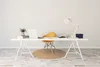 A minimalist home office setup with a desk, chair, laptop, and lamp. Produktbild-Vorschau