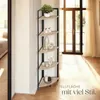 A corner shelf unit is displayed in a room with a large window and curtains in the background. Náhled obrázku produktu