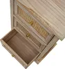 A close-up view of a wooden dresser with rattan drawer fronts and brass knobs. One drawer is partially open. Podgląd zdjęcia produktu