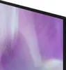 A close-up view of the corner of a television screen displaying a purple and white abstract pattern. Produktbild-Vorschau