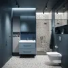 A modern bathroom with a vanity, toilet, and shower. Podgląd zdjęcia produktu
