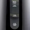A close-up view of a water level indicator on a black electric kettle, showing markings for maximum capacity and specific volume levels. Produktbild-Vorschau