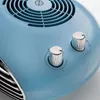 A close-up view of the top section of a blue fan heater, showing two silver control knobs and the fan grille. Produktbild-Vorschau