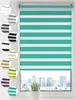 A turquoise and white striped roller blind is shown in a window overlooking a city skyline. Several color swatches of the roller blind are displayed on the left side of the image. Produktbild-Vorschau