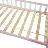Close-up view of a bed frame with wooden slats and pink and white side rails. Produktbild-Vorschau