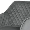 A close-up view of the quilted upholstery of a gray velvet chair. Náhled obrázku produktu
