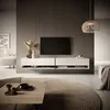 A modern living room with a TV unit, coffee table, and rug. Anteprima dell’immagine prodotto