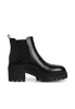 A black leather Chelsea boot with a thick lug sole and block heel, shown against a white background. Produktbild-Vorschau