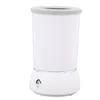 A white automatic dog paw cleaner with a gray rim on a white background. Voir les images du produit