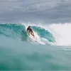 A surfer riding a wave. Produktbild-Vorschau