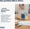 A small portable heater on a table with design sketches and art supplies. Voir les images du produit