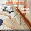 A person is rinsing a detachable blade under a faucet, with a slicer in the background. Podgląd zdjęcia produktu