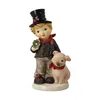 A ceramic figurine of a chimney sweep boy holding a four-leaf clover and standing next to a pig. Produktbild-Vorschau