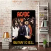 A poster of the band AC/DC is displayed on a brick wall, with a ladder shelf and a lamp next to it. Produktbild-Vorschau