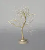 A decorative LED tree on a stand. Anteprima dell’immagine prodotto