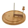 A cheese slicer with a bamboo base and metal cutting mechanism, isolated on a white background. Produktbild-Vorschau
