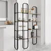 A modern kitchen with a black metal shelving unit filled with various kitchen items. Podgląd zdjęcia produktu