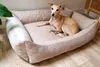 A dog is resting on a dog bed in a room. Náhled obrázku produktu