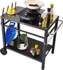 A black metal kitchen cart with a stovetop, cooking utensils, ingredients, and a propane tank. Produktbild-Vorschau