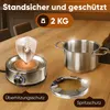 A stainless steel fondue pot and heating element are displayed on a wooden table, with marketing text overlays. Voir les images du produit