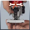 Close-up of a jigsaw, showing hands holding the blade and a red 'X' overlay with wrenches. Produktbild-Vorschau