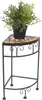 A potted plant sits on a corner plant stand. Náhled obrázku produktu