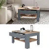 A coffee table in a living room setting, with a sofa and rug. Produktbild-Vorschau