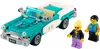 A teal and white vintage convertible Lego car with two Lego figures standing next to it. Náhľad obrázku produktu
