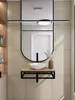 A modern bathroom vanity with a black metal console sink bracket, a wooden shelf, a white vessel sink, and a black faucet, mounted on a textured beige wall. Anteprima dell’immagine prodotto