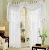 A set of white voile curtains draped over a doorway, with a glimpse of plants and a stone wall visible through the doorway. Produktbild-Vorschau