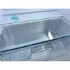 Close-up of a clear glass shelf inside a refrigerator. Produktbild-Vorschau