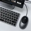 A close-up overhead view of a computer mouse and keyboard connected to a computer monitor. Produktbild-Vorschau