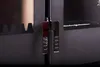 A close-up shot of the hinges and part of the door of a black wood-burning stove. Produktbild-Vorschau