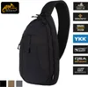 A black Helikon-Tex EDC sling backpack is shown against a white background, with various feature badges on the right side.