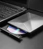 A close-up shot of an external DVD drive connected to a laptop, with a CD partially inserted. Produktbild-Vorschau