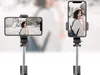 A woman is taking a selfie with a selfie stick and tripod. Náhled obrázku produktu