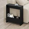 A black side table with books and a diffuser is placed next to a beige sofa. Produktbild-Vorschau