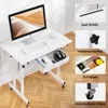 A white adjustable height desk with a computer, keyboard, mouse, and headphones on it. Insets show close-ups of features like the iPad slot, height adjustment knob, drawer contents, and locking casters. Podgląd zdjęcia produktu