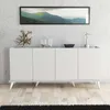 A white sideboard with decorative items on top, placed against a textured wall and wooden floor. Produktbild-Vorschau