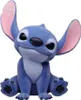 A blue Stitch figurine is sitting and looking forward against a white background. Produktbild-Vorschau