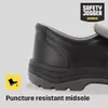 Close-up of a black safety shoe with text and a logo. Náhľad obrázku produktu