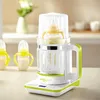 A baby bottle sterilizer and warmer on a countertop. Anteprima dell’immagine prodotto