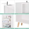 A collage of four images showcasing a white bookshelf. The top left shows an anti-tipping device. The top right shows rounded corners of the bookshelf. The bottom left displays the bookshelf filled with books and decorative items. The bottom right highligh Náhľad obrázku produktu