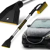 A car snow brush and ice scraper with an extendable handle, shown next to a snow-covered car. Produktbild-Vorschau