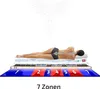 A person lying on a mattress with a diagram showing 7 zones of support. Produktbild-Vorschau